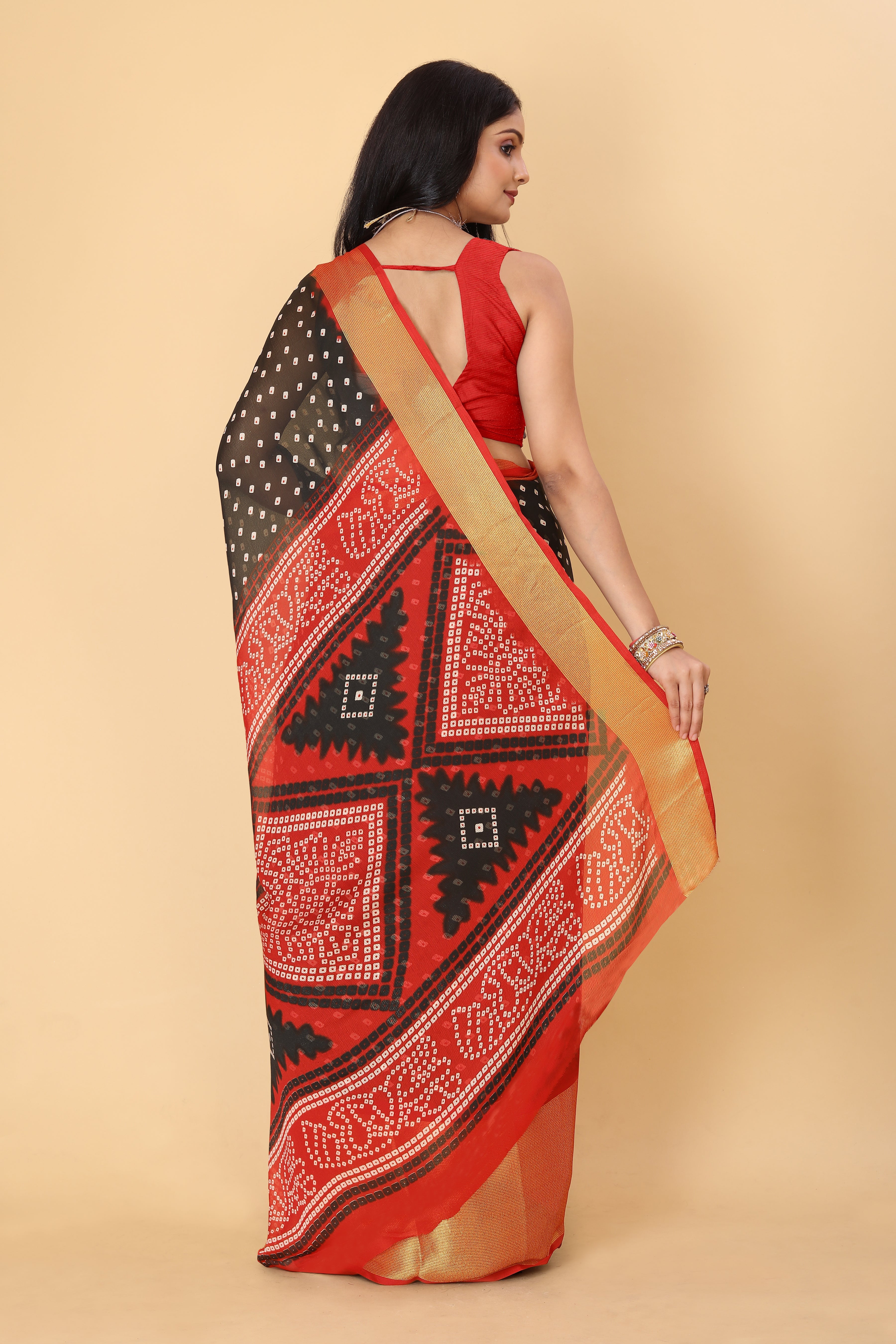 Bandhani Printed Moss Chiffon Black Saree with Gold Jari Border | Ivaara.